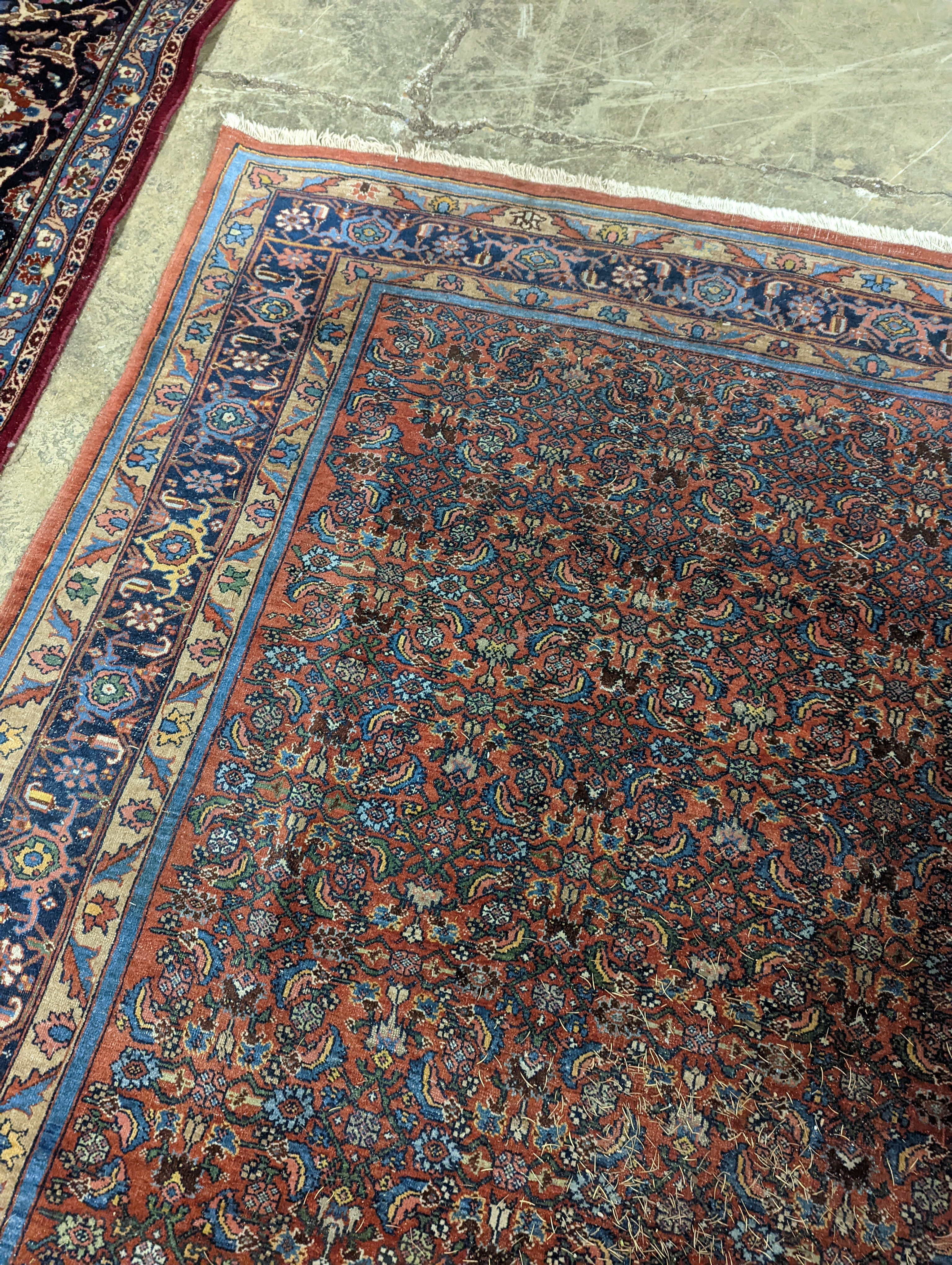 A North West Persian red ground carpet, 360 x 250cm